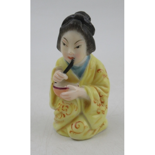 414 - A Royal Worcester candle snuffer, a geisha girl,1893, height 2.75ins