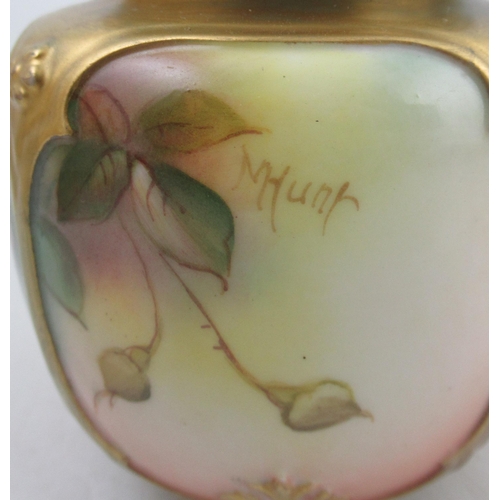 421 - A Royal Worcester covered vase, with quarter panels decorated with roses by Millie Hunt, shape No H1... 