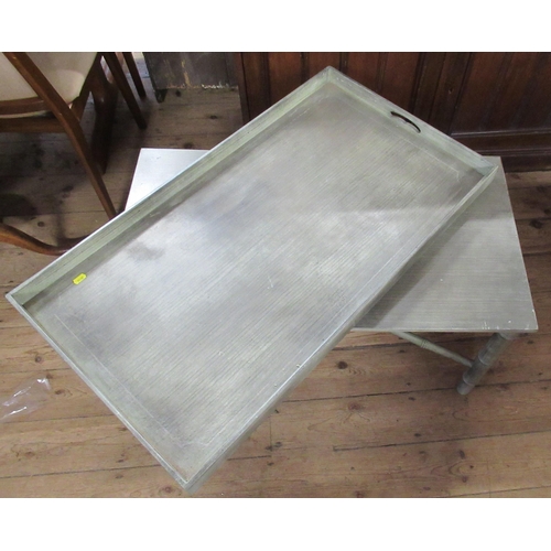 48 - A rectangular green coffee table, with lift off tray top and raised on a faux bamboo base, 36ins x 2... 