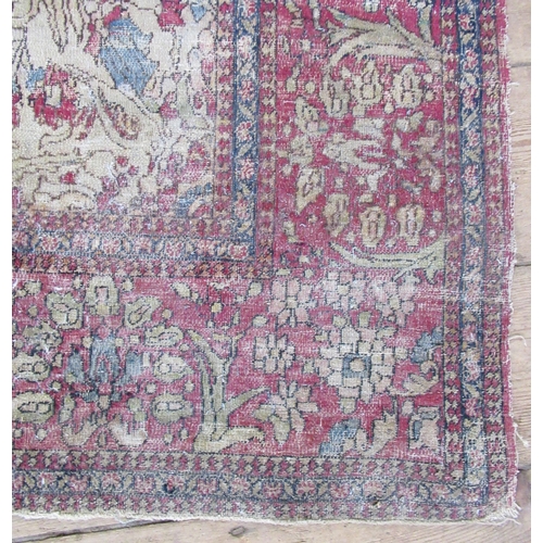 61 - An Eastern design rug, decorated with birds and foliage, 80ins x 54ins