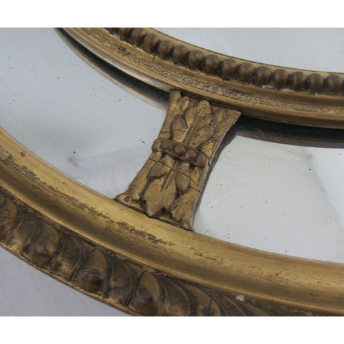 70 - A 19th century gilt framed circular wall mirror, diameter 19ins