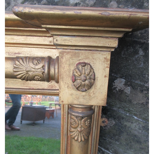 71 - A Regency rectangular over mantle mirror, the gilded frame with applied half round column width 56in... 