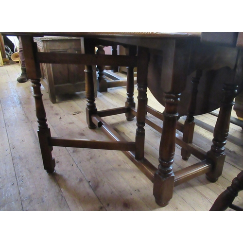 58 - An oak gate leg table, width 46ins