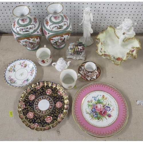 104 - A collection of porcelain to include a pair of vases, Moore Bros bowl, plates, coffee cans etc