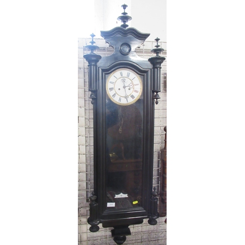 112 - A Vienna style wall clock, with ebonised case, height 50ins