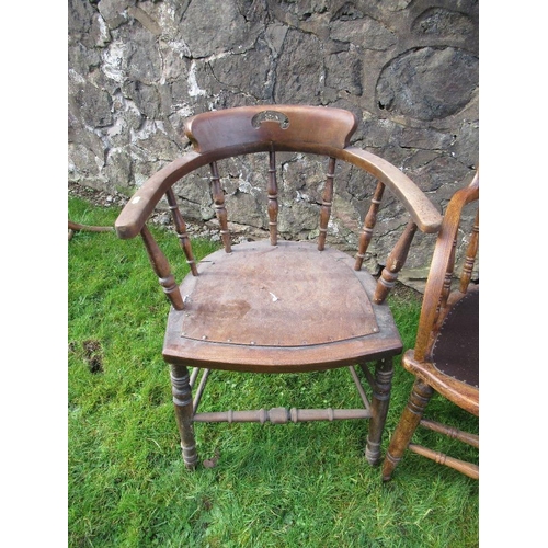 14 - A pair of oak curved back chairs, with spindle supports, together with two other chairs