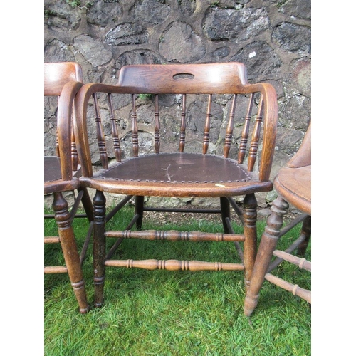 14 - A pair of oak curved back chairs, with spindle supports, together with two other chairs