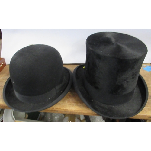 159 - A Lincoln Bennett black top hat, together with a RW Forsyth black bowler hat