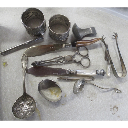 166 - Two silver capstan inkwells, together with other silver and metalware