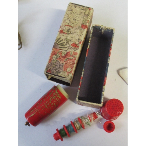 178 - A collection of sewing related items, to include thimbles, bobbin cases, needle cases, etc