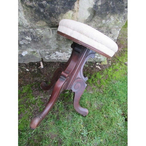 18 - A 19th century style mahogany circular piano stool