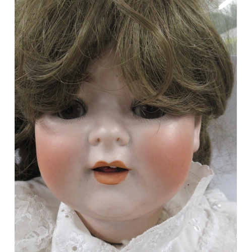 193 - A Porzellanfabrik Burggrub bisque headed doll, impressed 169 special 12, with composition body, heig... 