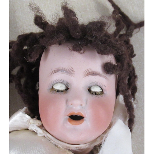 193 - A Porzellanfabrik Burggrub bisque headed doll, impressed 169 special 12, with composition body, heig... 