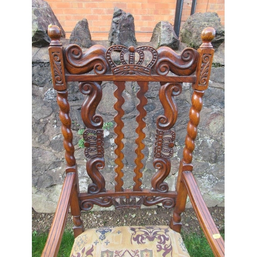 2 - An  antique elm open arm chair the pierced back decorated with craved crowns the back stamped, 