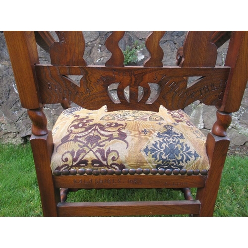 2 - An  antique elm open arm chair the pierced back decorated with craved crowns the back stamped, 