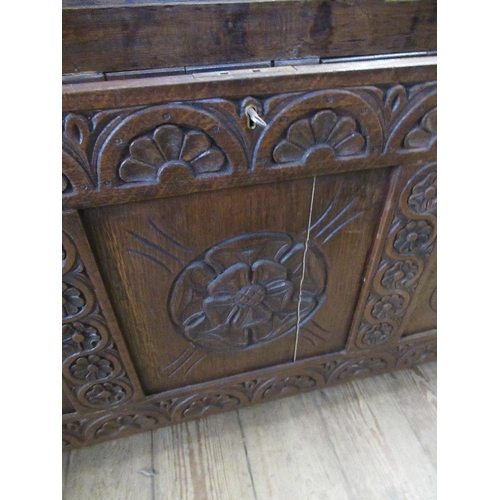 20 - An antique style oak coffer with fielded panels, width 47ins, depth 19ins, height 23ins