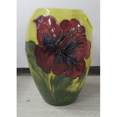 209 - A Moorcroft vase, decorated in the Hibiscus pattern, height 5.5ins