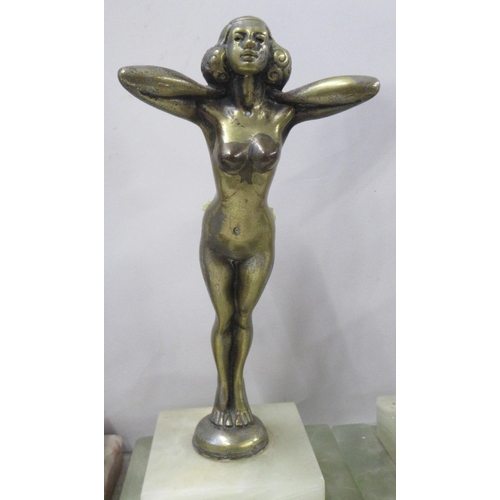 223 - A bronze figure, of a woman, on stepped marble base, height 12ins, together with two gilded metal fi... 