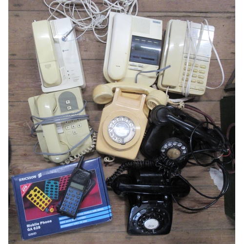 232 - A collection of telephones  to include vintage and later examples