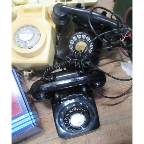 232 - A collection of telephones  to include vintage and later examples