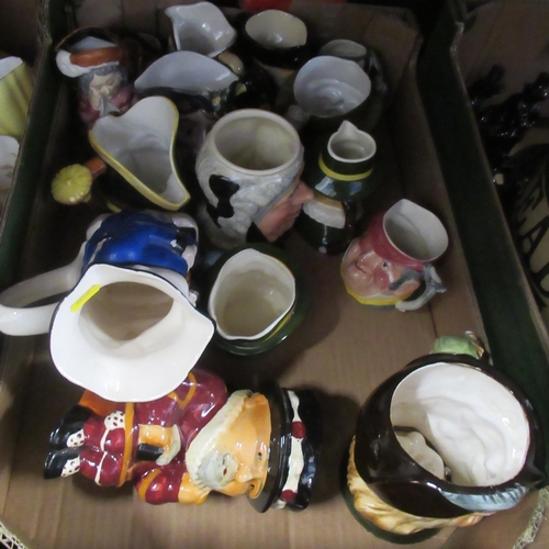 235 - Two boxes of china to include character jugs, flagon, vases etc