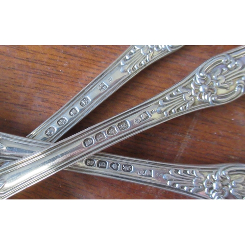 294 - A set of four Georgian silver serving spoons, engraved with an initial, together with two other Geor... 