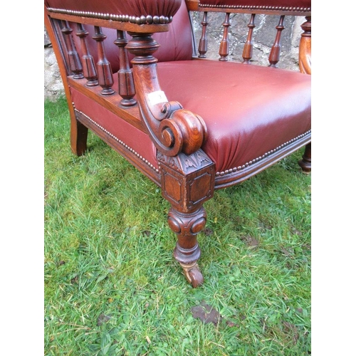 3 - A Victorian show wood open arm chair with leather seat, back and arms raised on turned feet