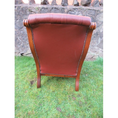 3 - A Victorian show wood open arm chair with leather seat, back and arms raised on turned feet