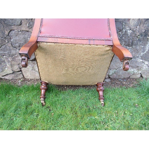 3 - A Victorian show wood open arm chair with leather seat, back and arms raised on turned feet