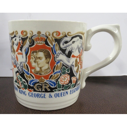 313 - A Royal commemorative mug, designed by Dame Laura Knight