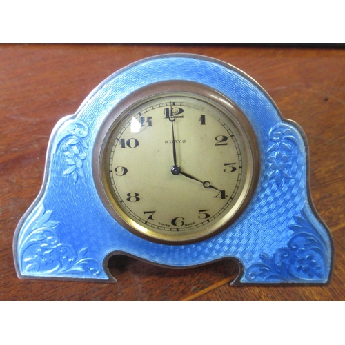 321 - A silver and enamel clock, decorated with blue enamel, Chester circa 1939