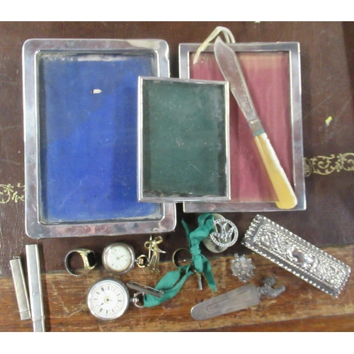 323 - A collection of silver items, to include frames