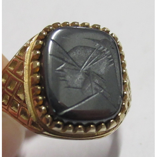 330 - A gold signet ring, set with a carved stone, marked .975, weight 3.7g