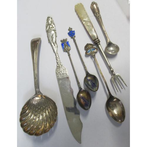 333 - A collection of flatware, to include a silver sifting spoon, a silver spoon with enamel decoration, ... 