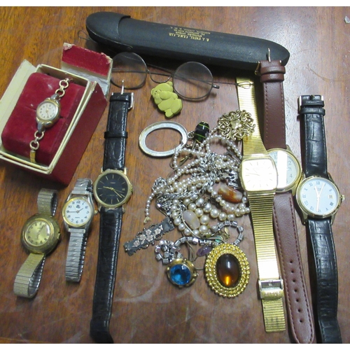 335 - A collection of costume jewellery and wrist watches