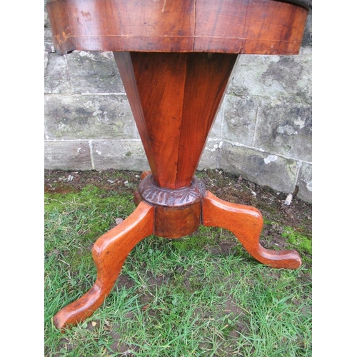 36 - A 19th century walnut sewing table, with rising lid to reveal fitted compartments, height 24ins, dia... 