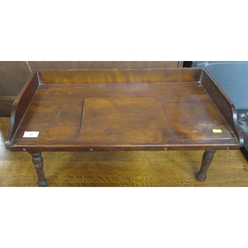 47 - A mahogany folding bed table, width 25ins