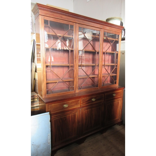 74 - A 19th century mahogany and satinwood inlaid glazed cabinet, the upper section with three astragal g... 