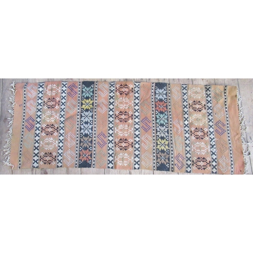 86 - A pink ground runner, 120ins x 32.5ins, together with a mat, 54ins x 21ins