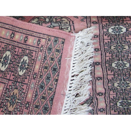 86 - A pink ground runner, 120ins x 32.5ins, together with a mat, 54ins x 21ins