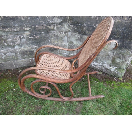 20B - A Brentwood Rocking Chair with cane seat and a cane back