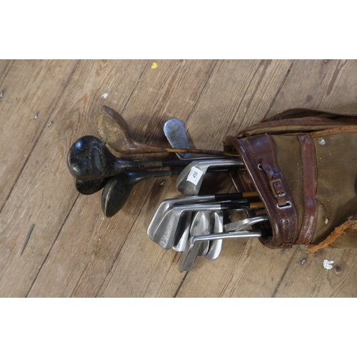 459 - A collection of vintage golf clubs