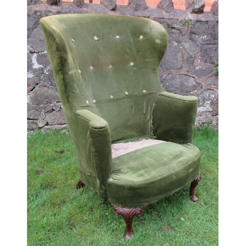 19 - A curved back wing armchair