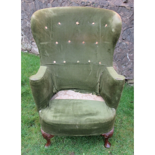 19 - A curved back wing armchair