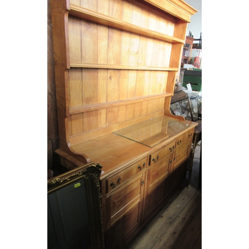 21 - An modern possible elm dresser, with plate rack, width 62ins, height 82ins