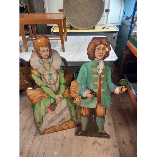 24 - A pair of painted stands , decorated with figures in period dress