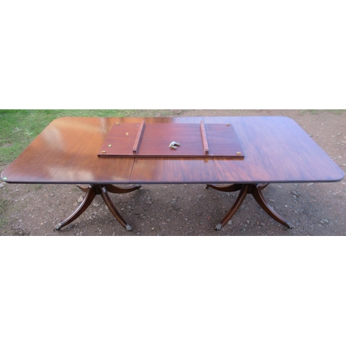 26 - A The Thomas Glenister Company High Wycombe regency style mahogany pedestal dining table, with two l... 