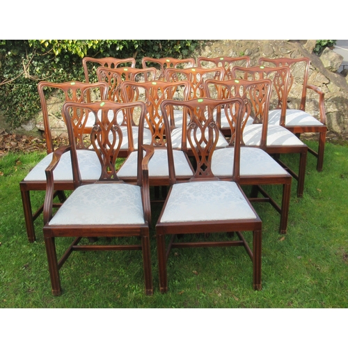 27 - A set of 12 (10+2) mahogany dining chairs, with pierced vase splat backs and drop in seats