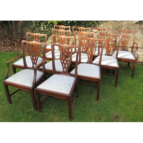 27 - A set of 12 (10+2) mahogany dining chairs, with pierced vase splat backs and drop in seats