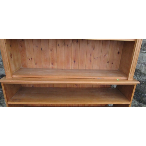 35 - A pine double bookcase, fitted with two drawers to the base, width 54ins, depth 16ins, height 84ins